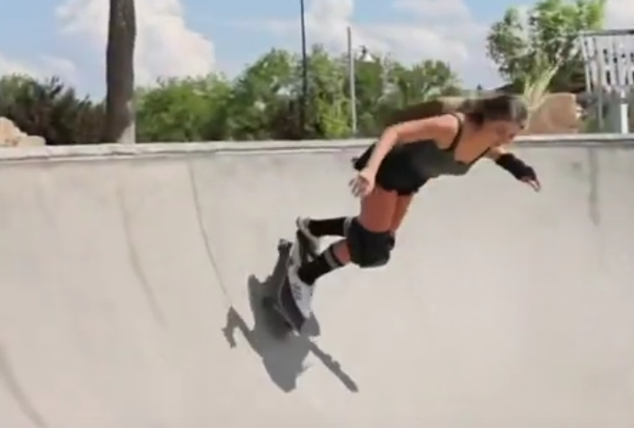 Skateboarding in a halfpipe